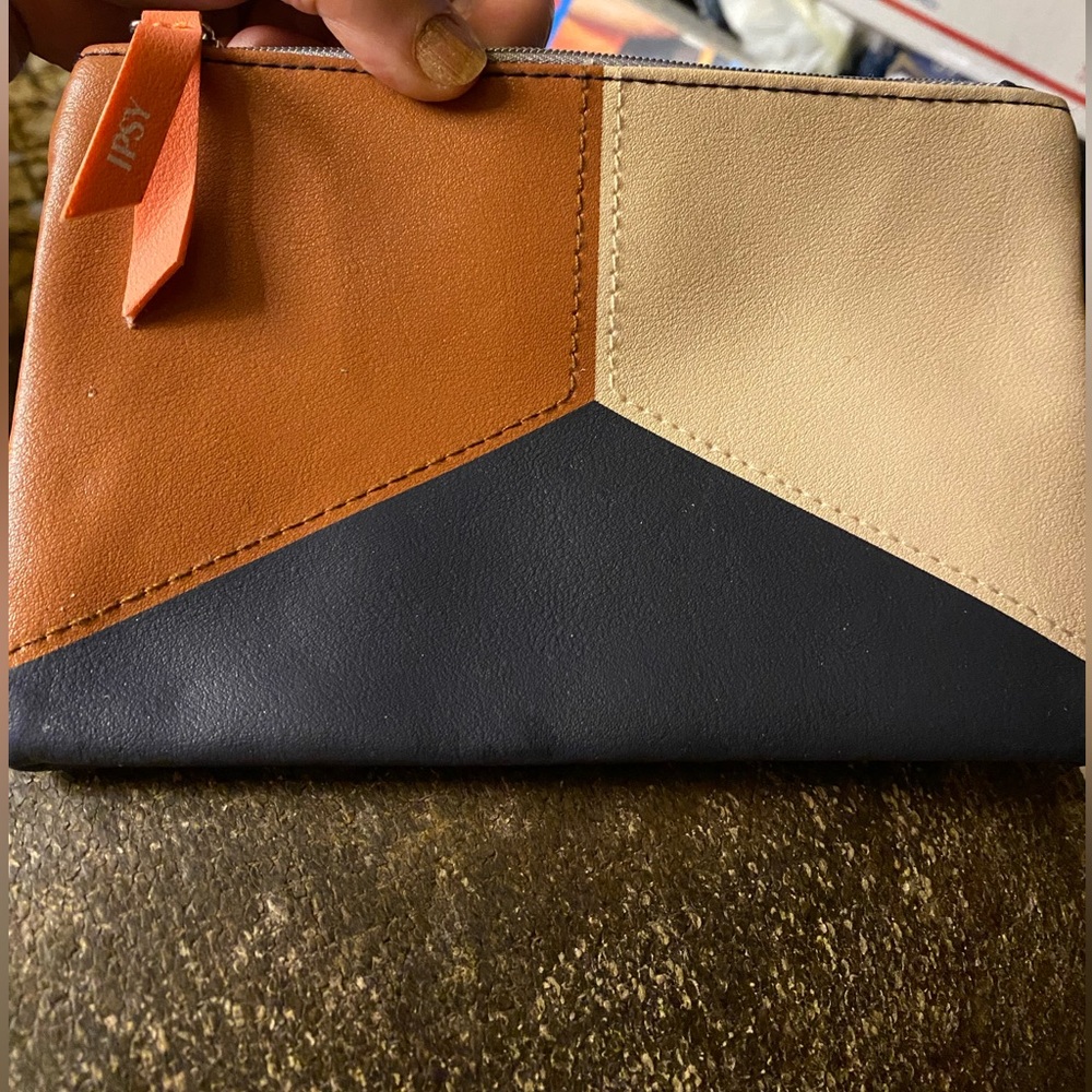 IPSY pouch with orange logo ribbon